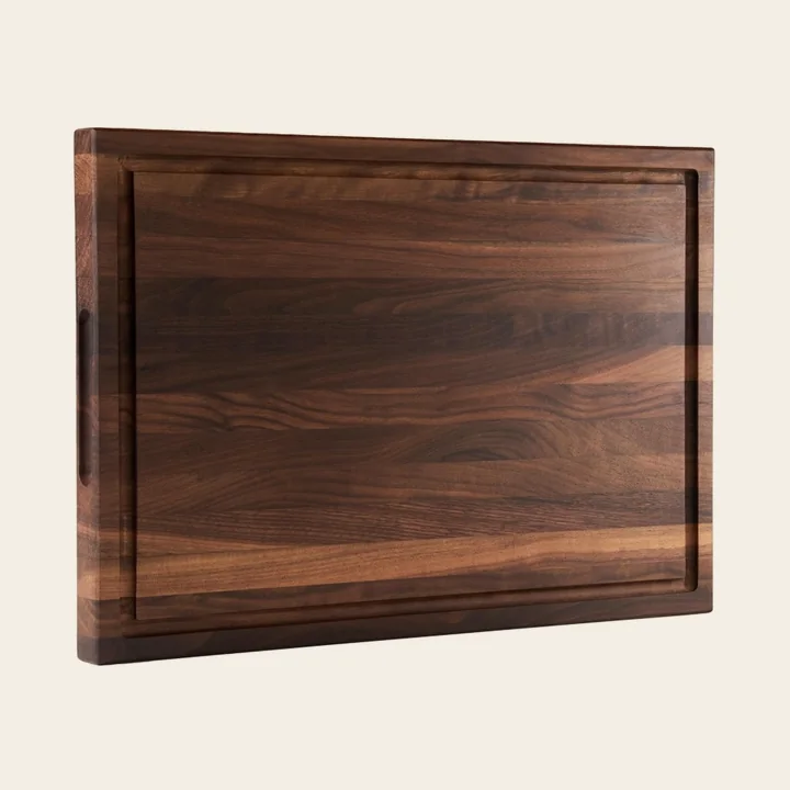 Black walnut natural-grain cutting board with a juice groove